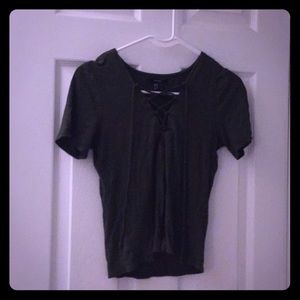 A dark green tee, with a cut down the middle.